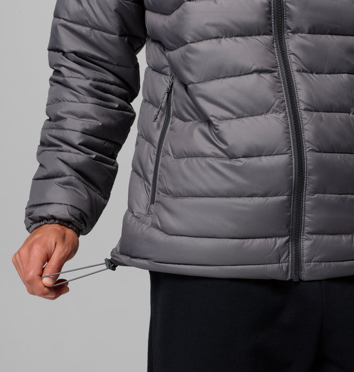 Columbia Powder Lite II jacket detail, dark gray zip pocket seam and elastic hem cinch