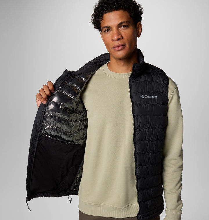 Black puffer vest with full-zip, chest logo, partially open front lining