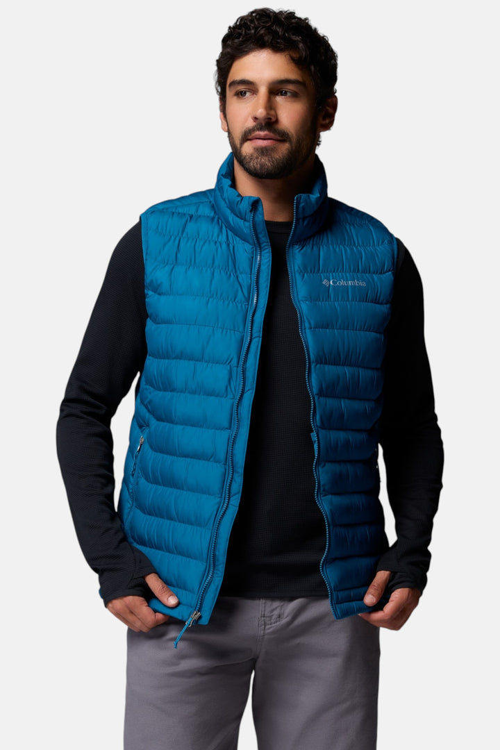 Men's blue quilted puffer vest with front zipper and high stand collar.