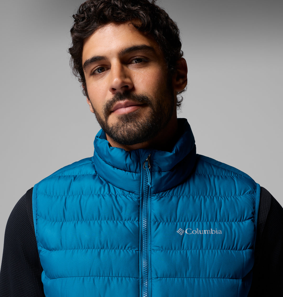 Blue quilted puffer vest with zip-front and Columbia logo on the chest.