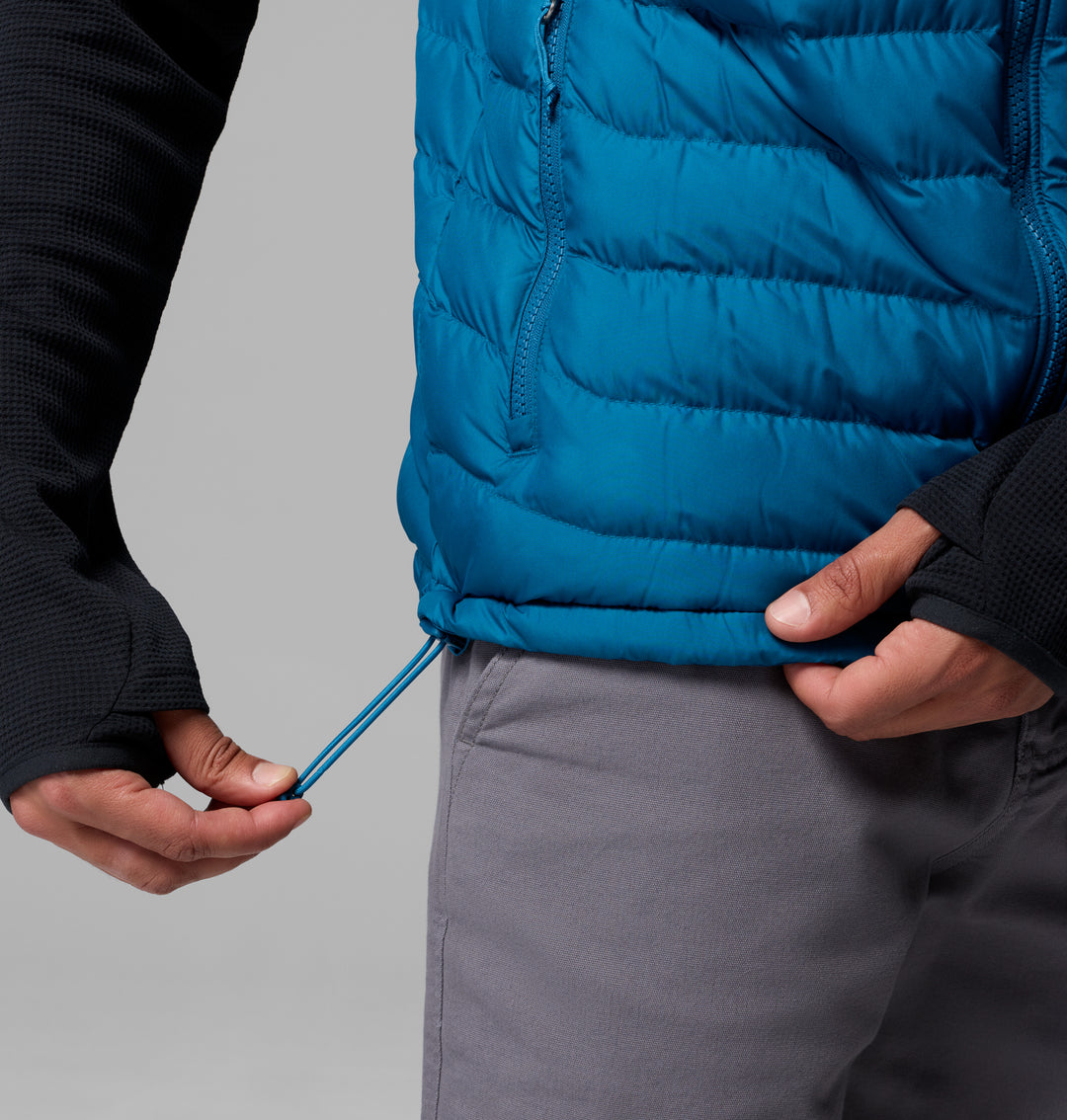 Blue quilted puffer vest with zip-front and drawcord hem.