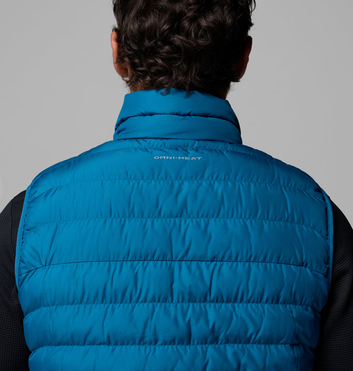 Blue quilted puffer vest, back view, mock-neck collar and logo text.