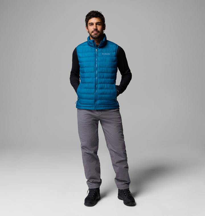 Men's blue quilted puffer vest with zip-front and standing collar.