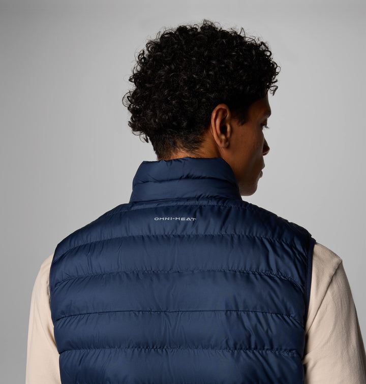 Men's navy quilted insulated vest back view with Omni-Heat label