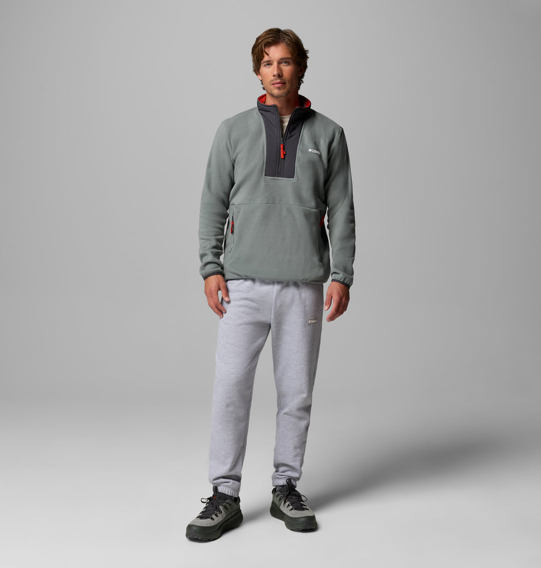 Men's sage green fleece half-zip with black center panel, side zip pocket details