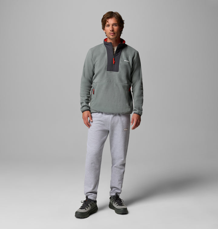 Men's sage green fleece half-zip with black center panel, side zip pocket details