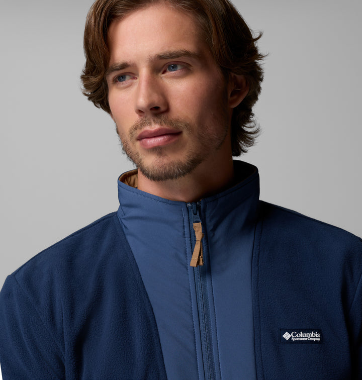 Navy fleece half-zip with stand collar, gold zipper pull, and Columbia logo patch