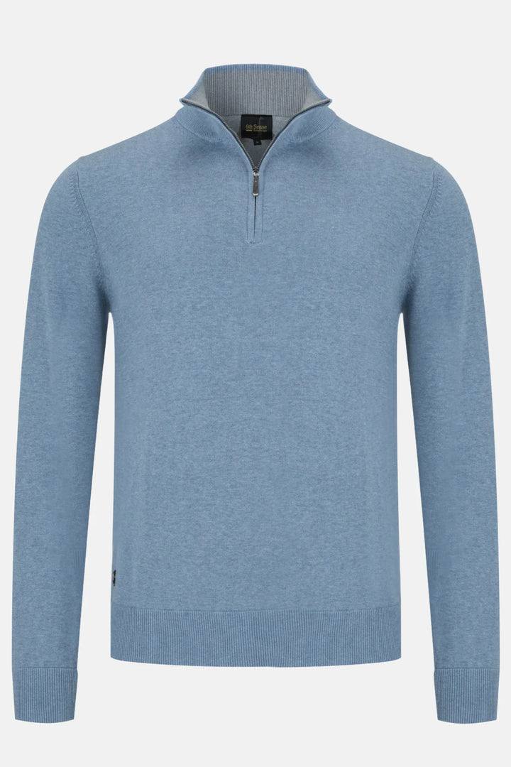 Blue sweater with a zipper on a light gray background