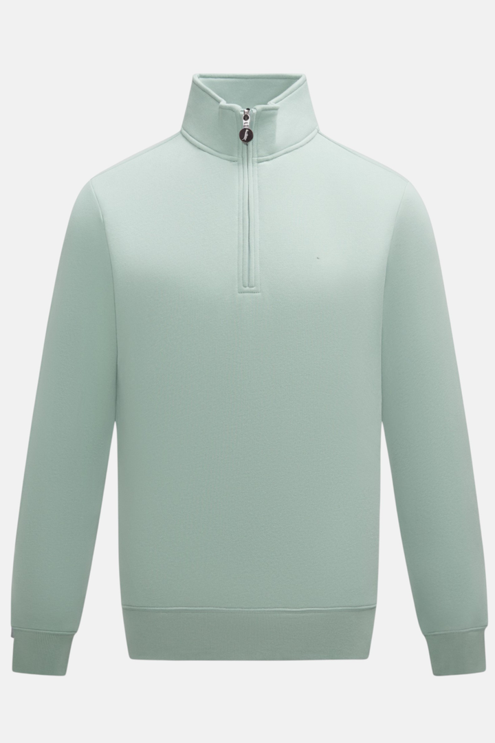 6th Sense Flux quarter-zip top in pale jade, front view with stand collar and long sleeves