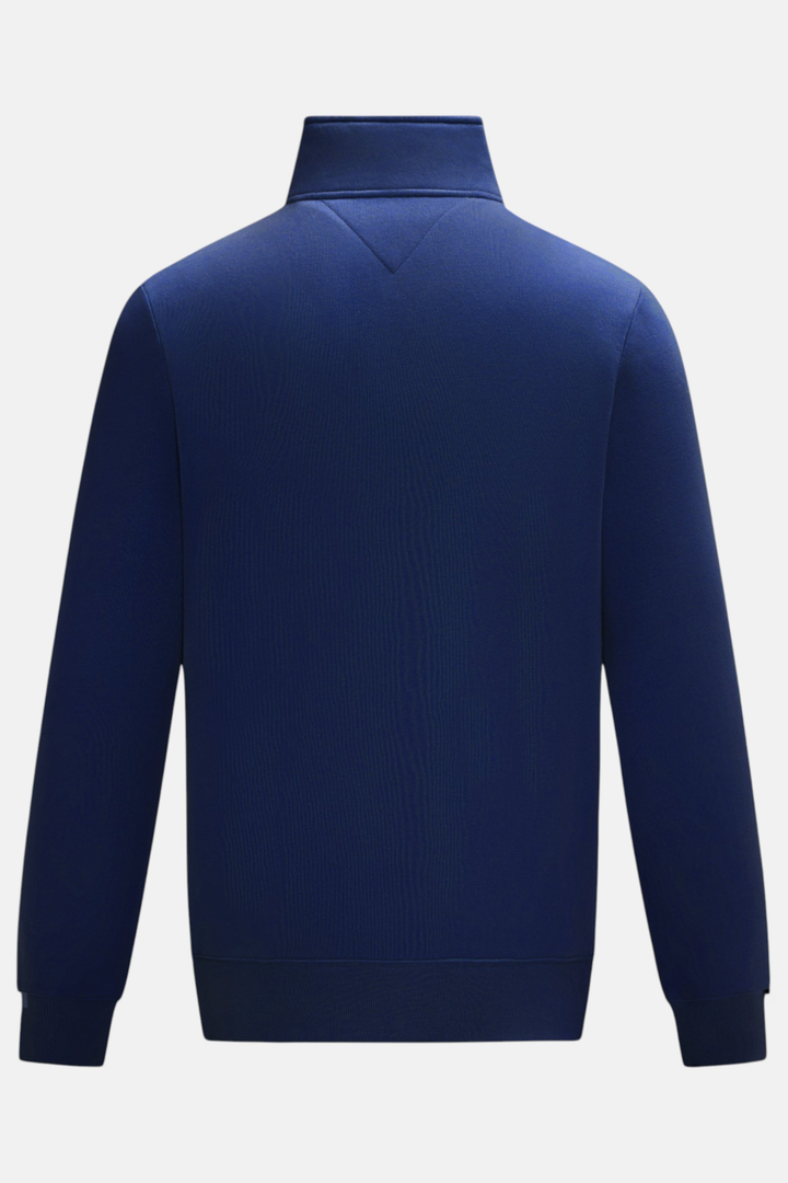 Back of the navy 1/4-zip top, with a stand collar and long sleeves