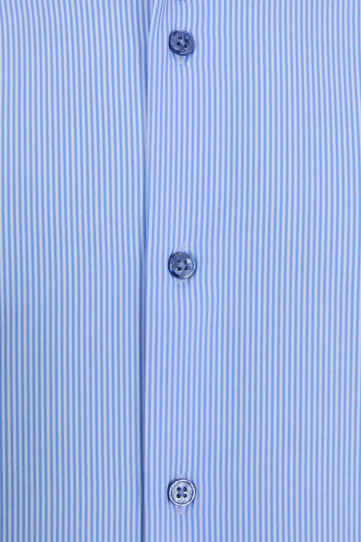 Striped performance shirt placket close-up with three blue buttons and stitched seams