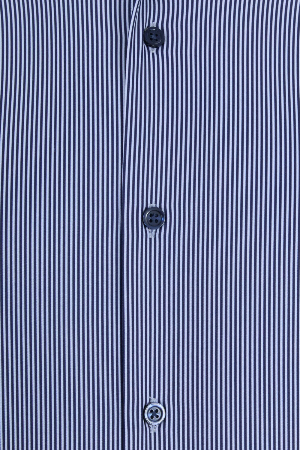 Light blue striped shirt placket with three dark buttons