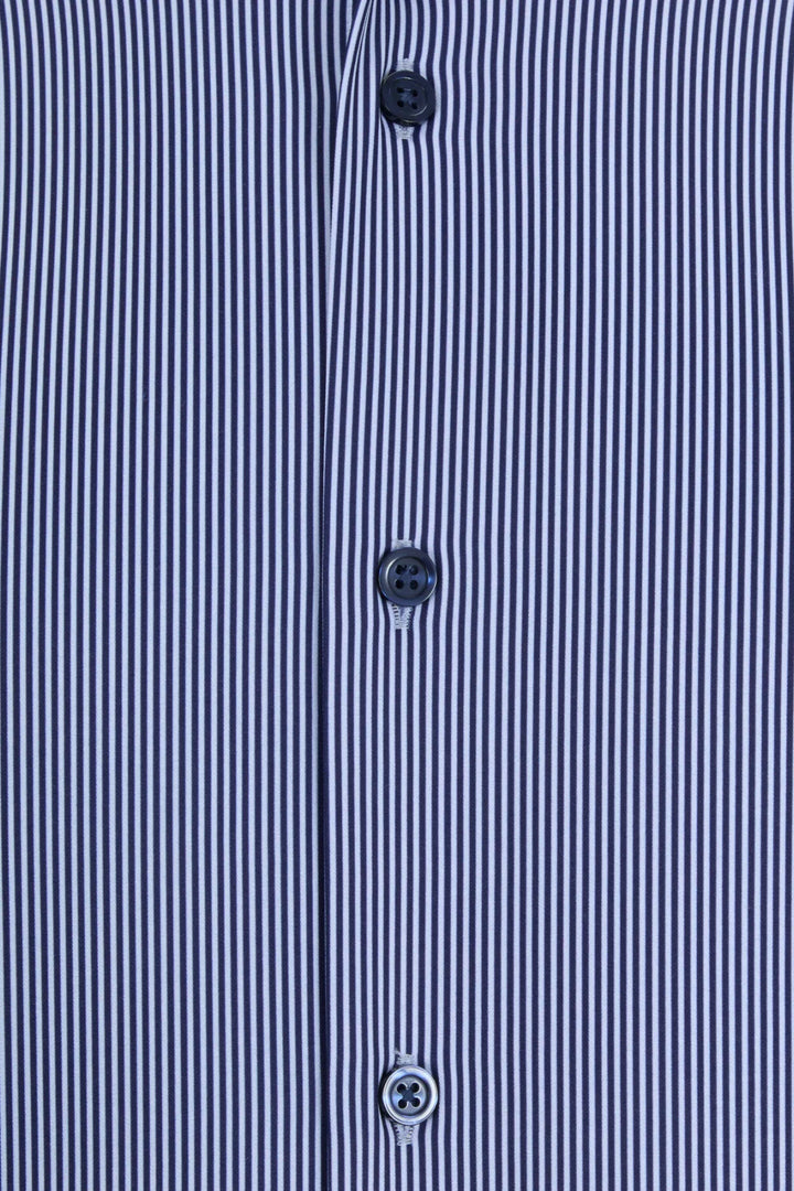 Light blue striped shirt placket with three dark buttons