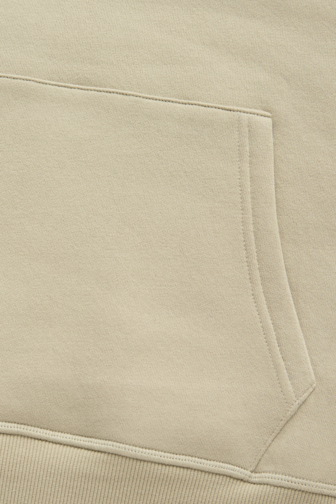 Hoodie close-up of the front pouch pocket stitching and ribbed hem