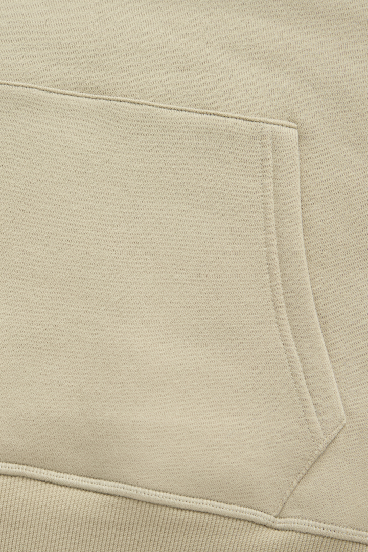 Hoodie close-up of the front pouch pocket stitching and ribbed hem