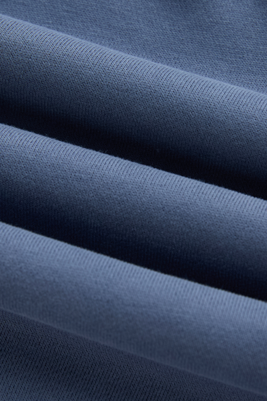 6th Sense hoodie close-up showing the blue knit fabric texture