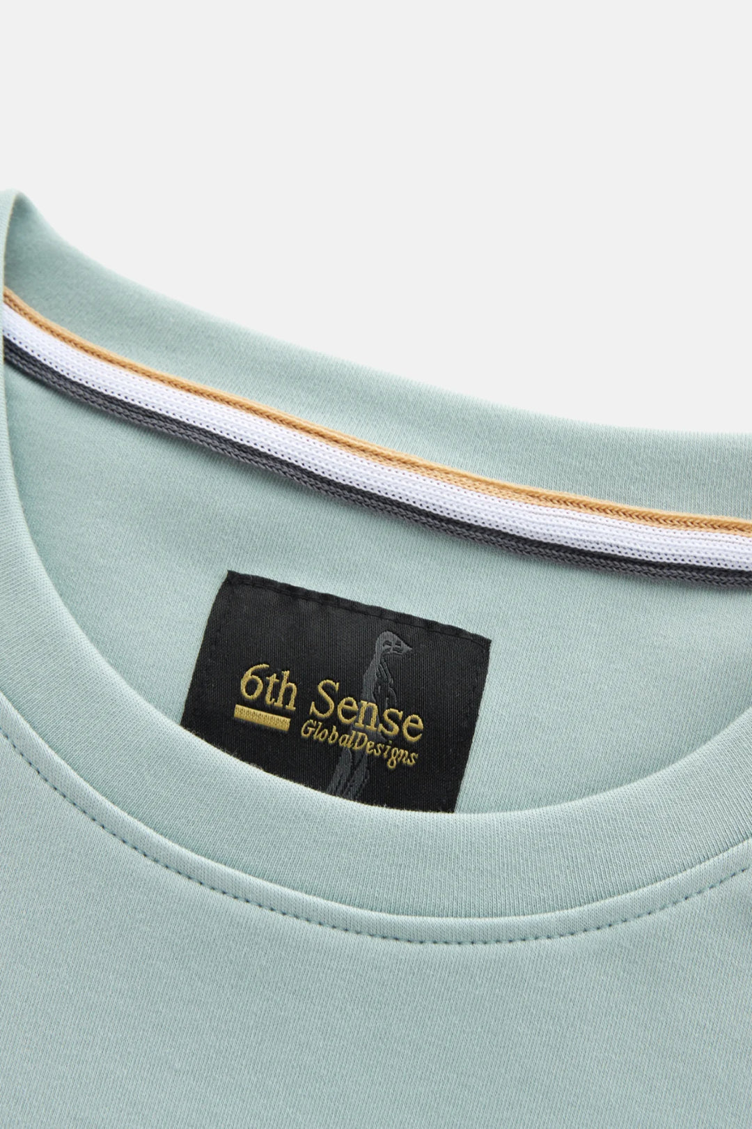 Mist green crew neck T-shirt with 6th Sense brand label at neckline