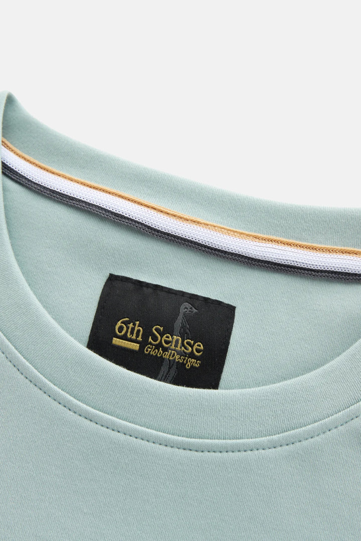 Mist green crew neck T-shirt with 6th Sense brand label at neckline
