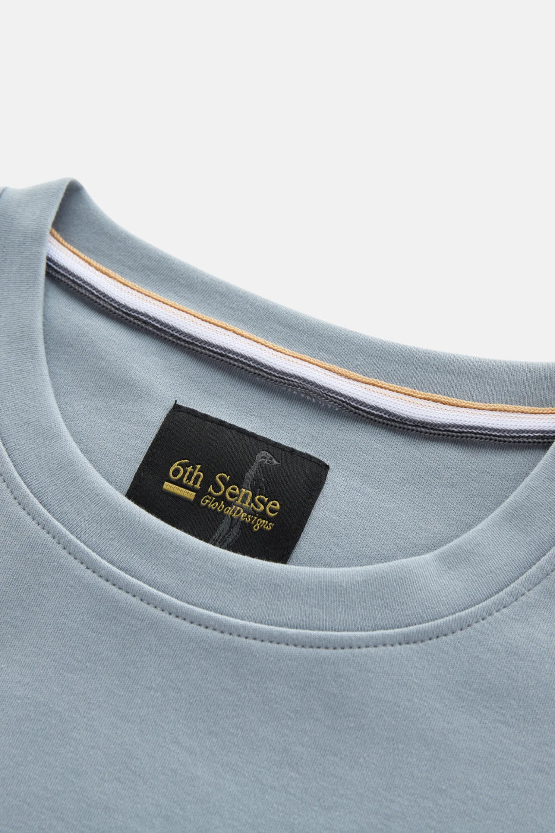 Light blue liquid t-shirt collar with 6th Sense logo neck label