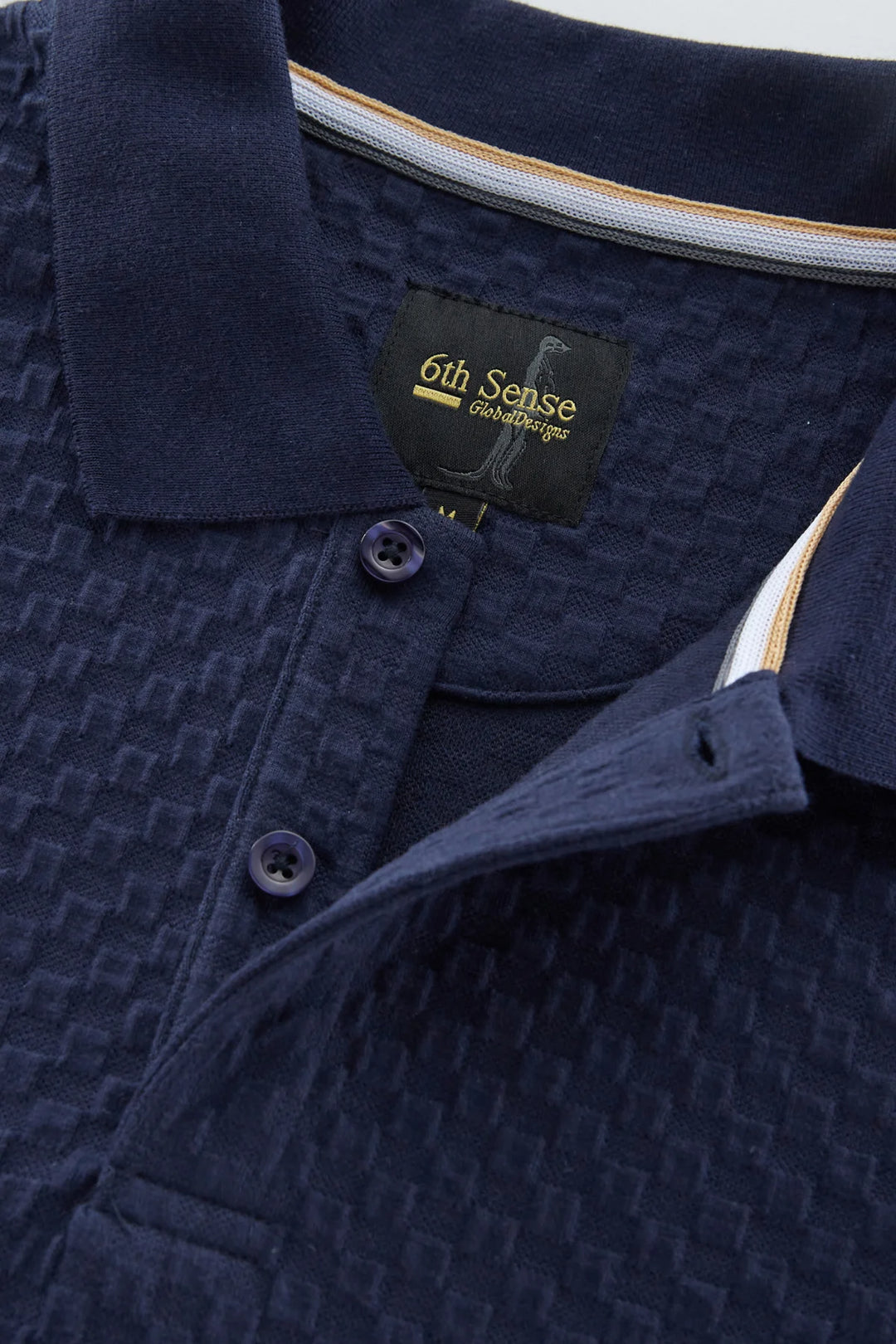 Navy jacquard polo shirt with ribbed collar and button placket