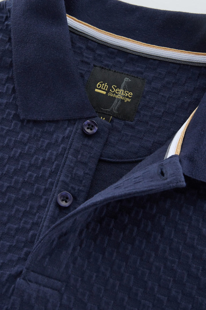 Navy jacquard polo shirt with ribbed collar and button placket
