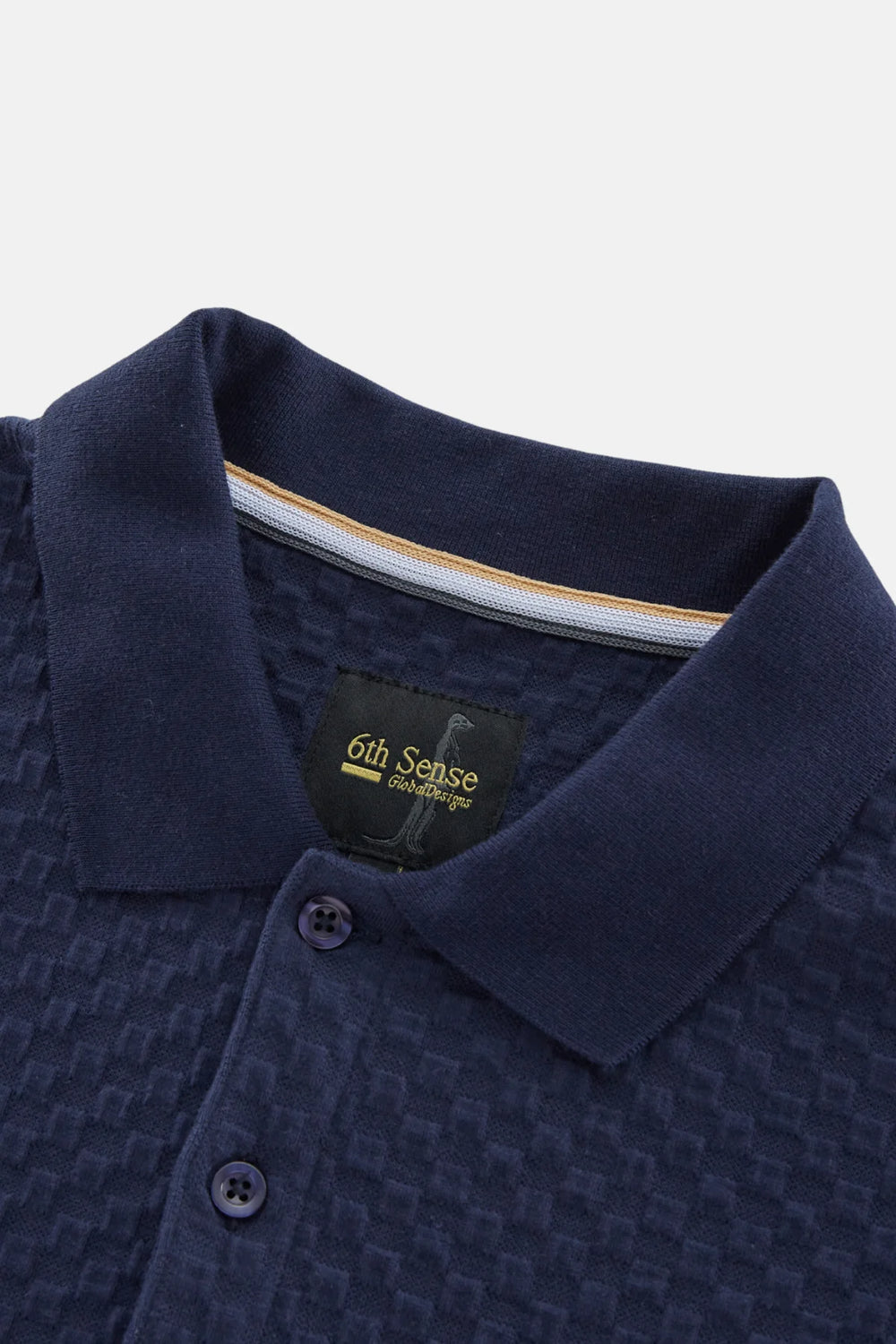 Navy jacquard polo shirt with branded neck label and button placket