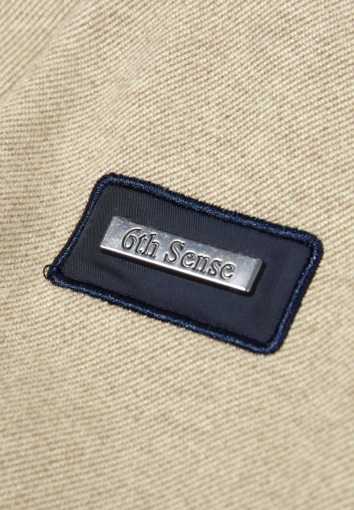6th Sense logo patch on dark-trimmed neckline of cobblestone 1/4-zip top