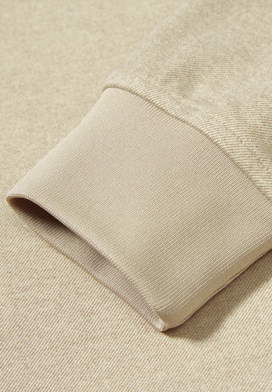 Cobblestone knit sleeve cuff with ribbed hem edge detail