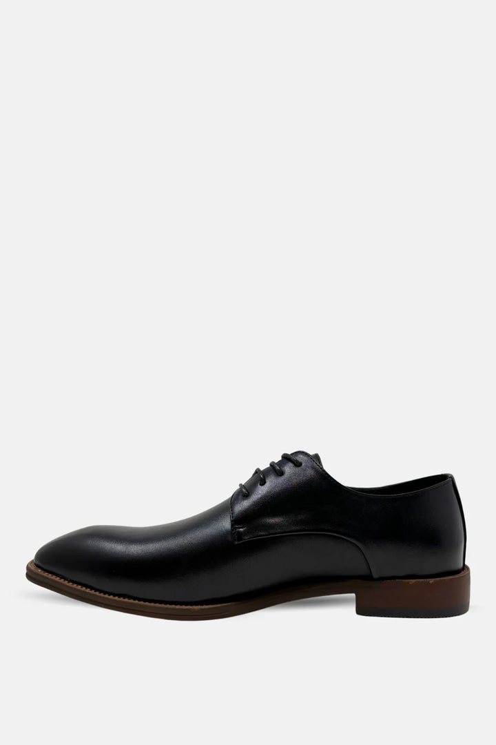 Black leather lace-up oxford dress shoe side view with brown sole edge