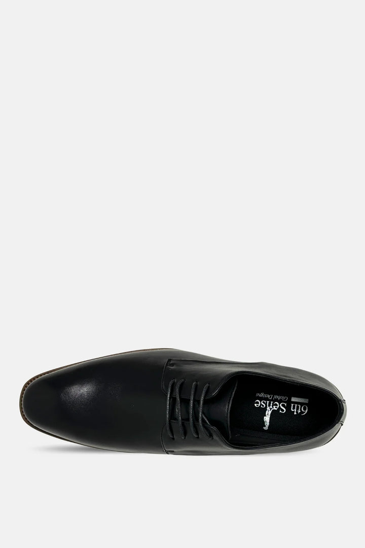 Black leather lace-up oxford shoe close-up, black laces and round toe