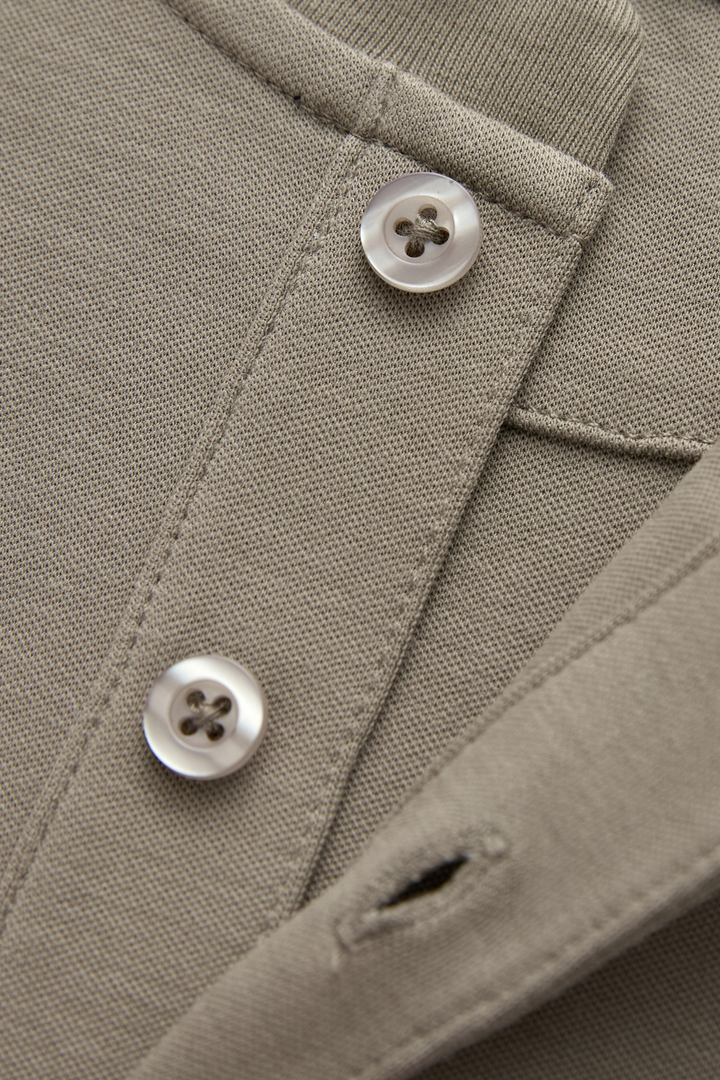 Close-up of the top's textured fabric, button placket, and buttons
