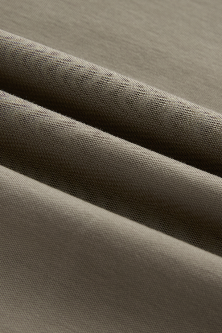 Close-up showing the top's fine, textured fabric