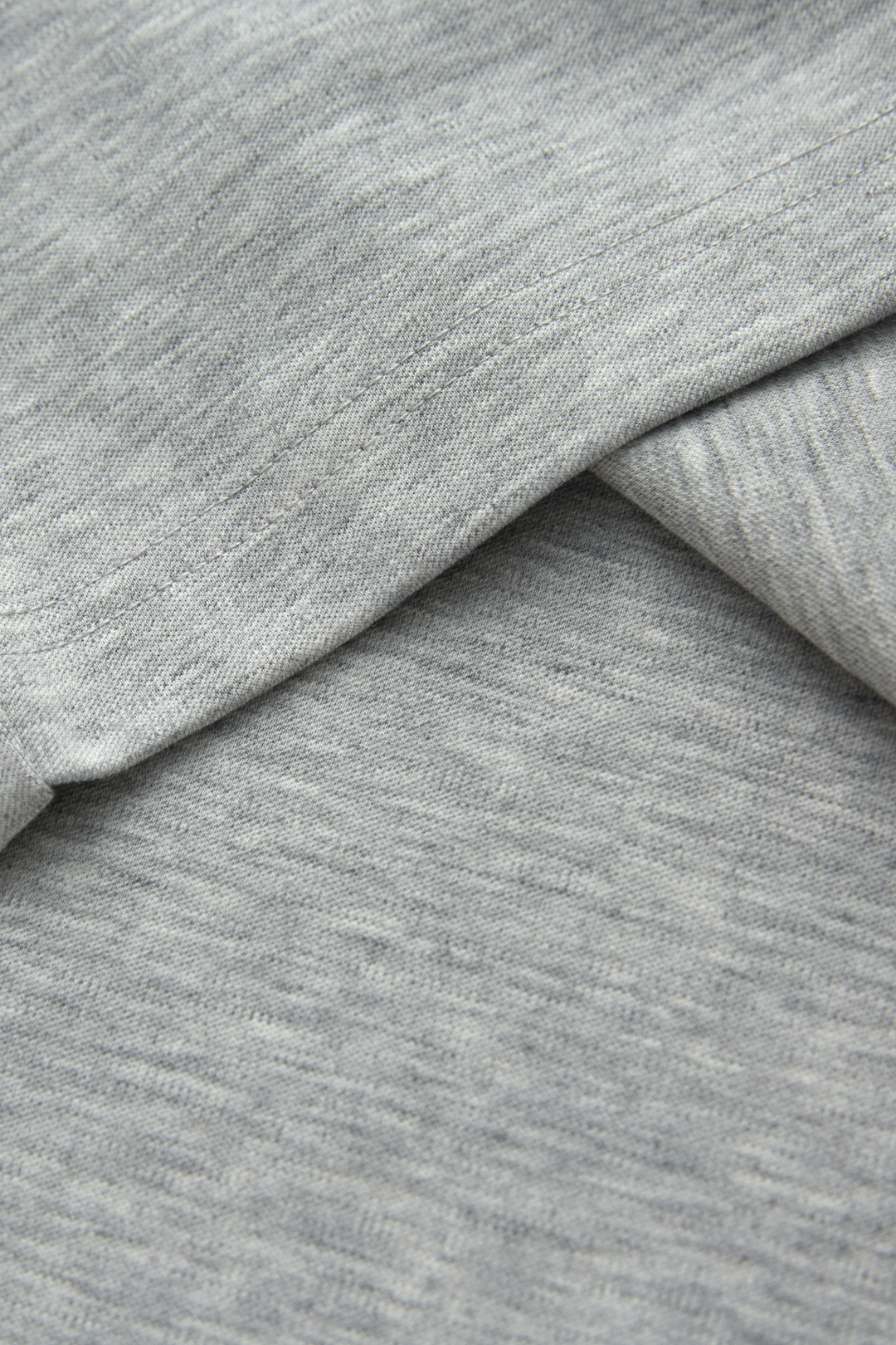 Gray henley top fabric with a soft, fine heathered knit texture