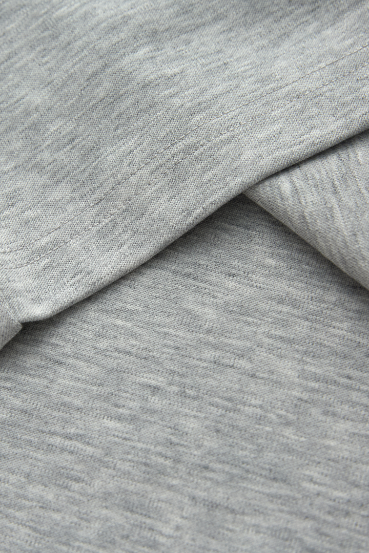 Gray henley top fabric with a soft, fine heathered knit texture