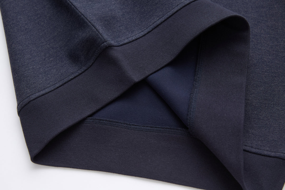 Navy 1/4-zip top with ribbed cuffs and seam detailing