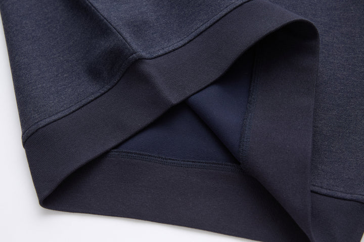 Navy 1/4-zip top with ribbed cuffs and seam detailing