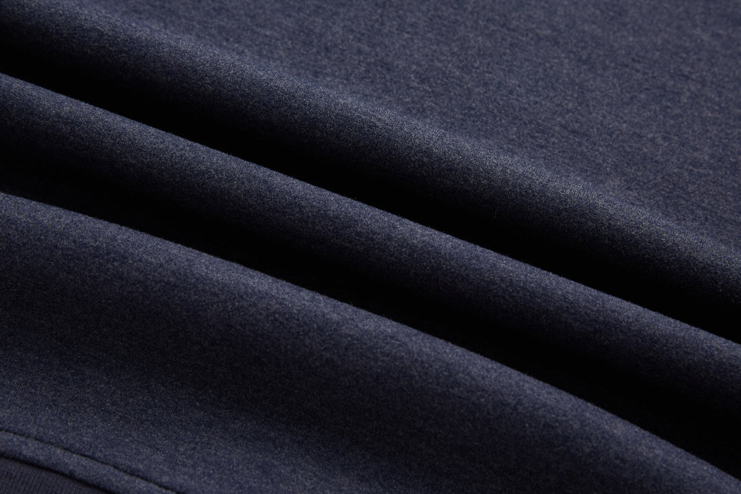Navy knit fabric of the 1/4-zip top with smooth texture