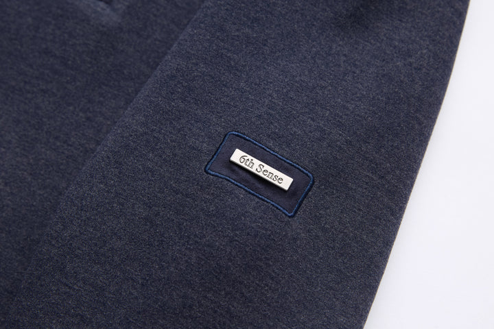 Navy 1/4-zip top with small logo patch on chest