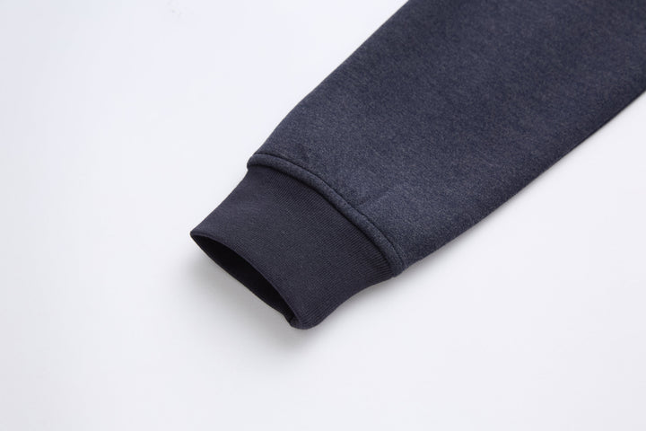 Navy 1/4-zip top sleeve cuff with ribbed knit finish