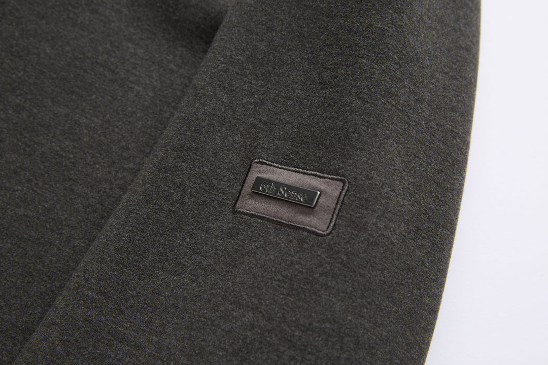 Peat 1/4-zip top logo patch on sleeve