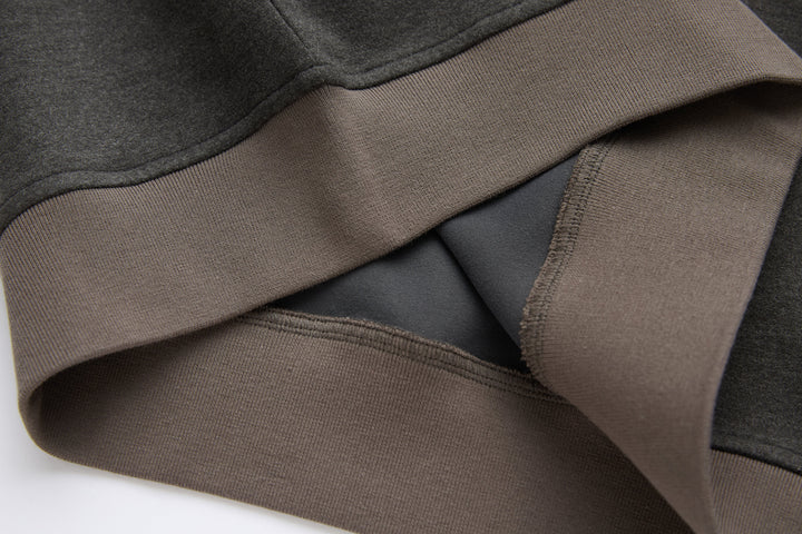 Peat 1/4-zip top ribbed cuff and hem detail