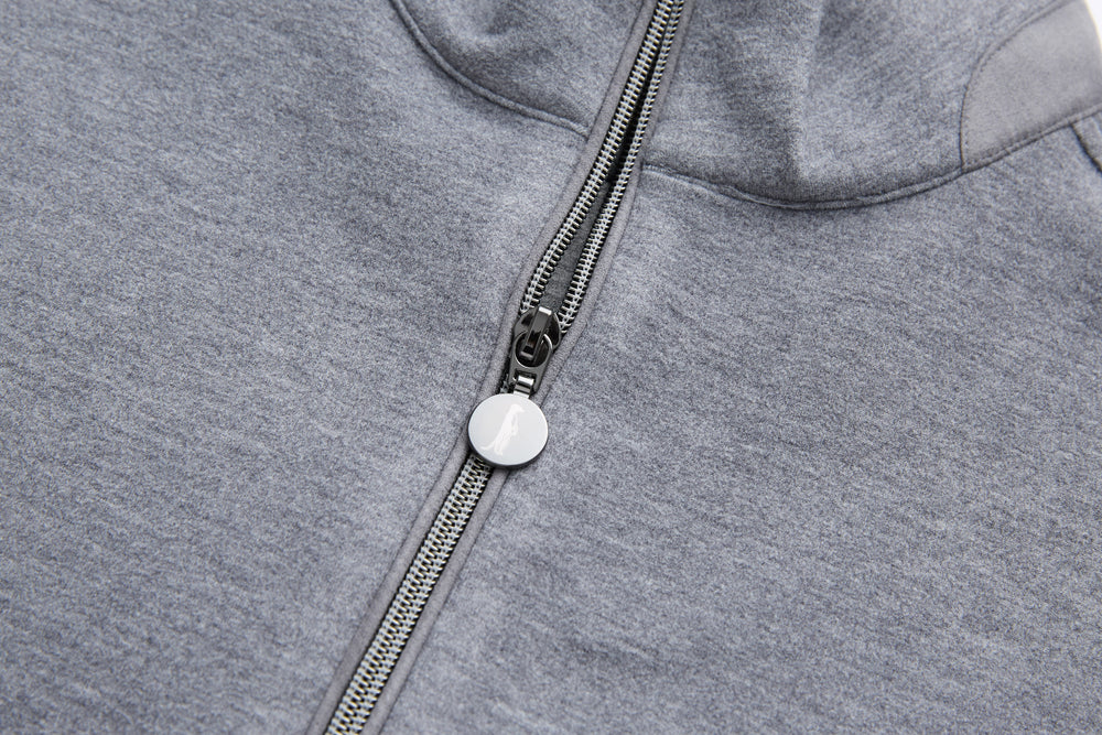 Gray quarter-zip top neckline with metal zipper pull and striped zipper tape
