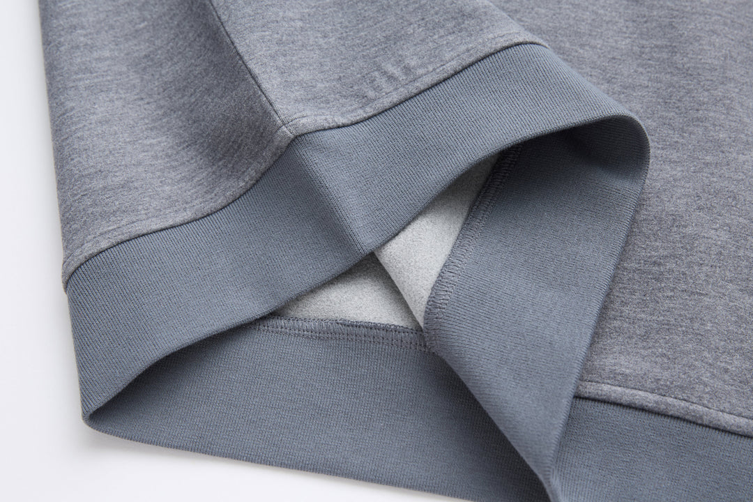 Gray knit hem and ribbed cuffs with inner facing of quarter-zip top