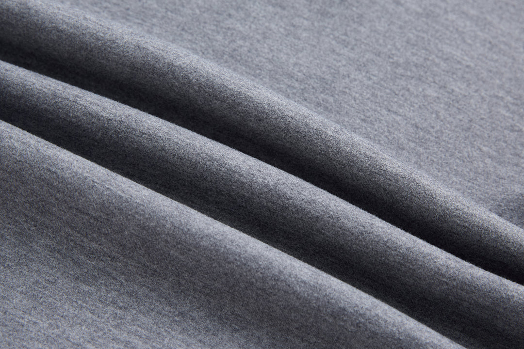 Heathered gray fabric with smooth knit texture on quarter-zip top