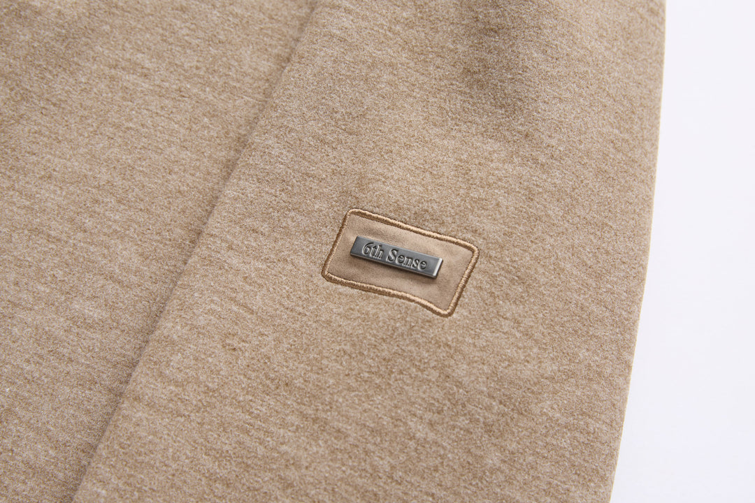 Taupe 1/4-zip top with 6th Sense logo patch