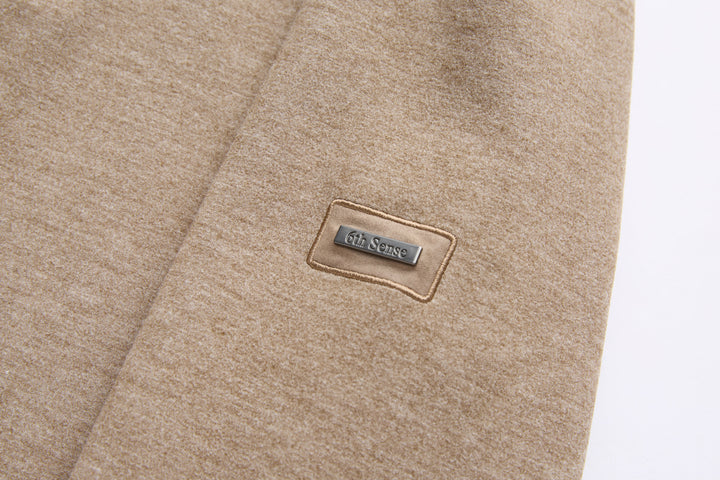 Taupe 1/4-zip top with 6th Sense logo patch