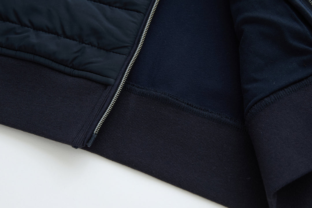 Navy sleeveless gilet with zip front and ribbed hem trim