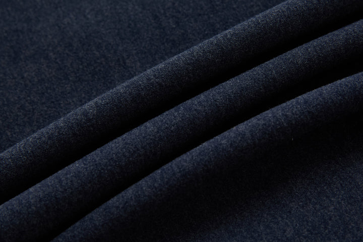 Dark navy gilet fabric panel close-up, textured knit and quilting