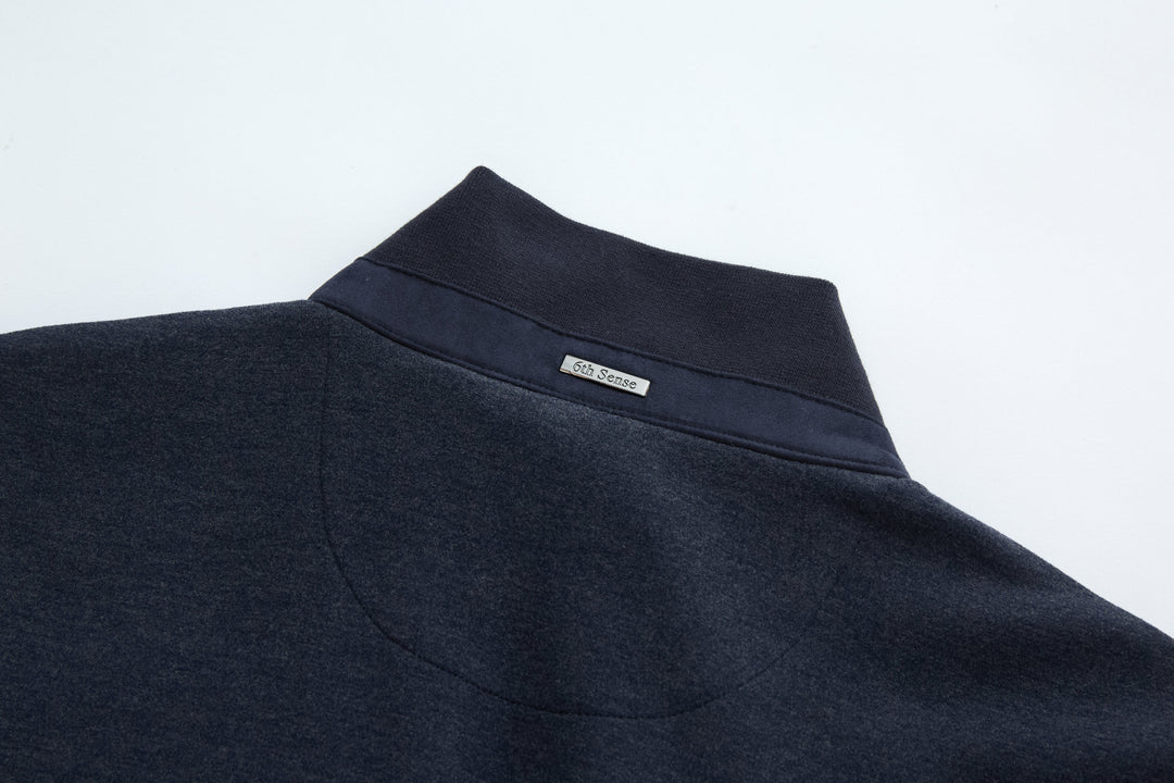 Navy stand collar gilet vest with small logo label at neckline
