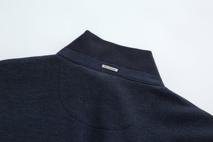 Navy stand collar gilet vest with small logo label at neckline